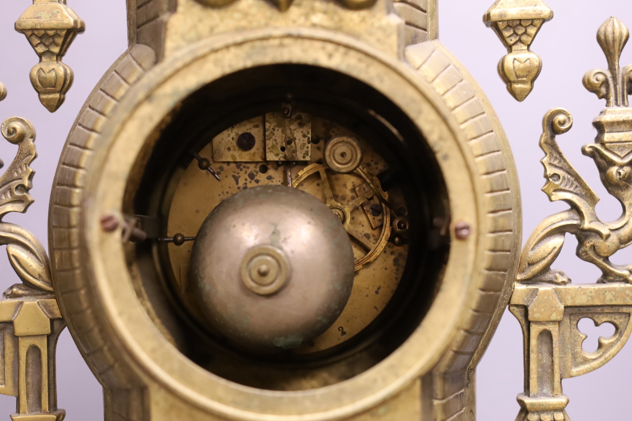 An ornamental gilt brass clock with French bell striking movement - 59cm tall